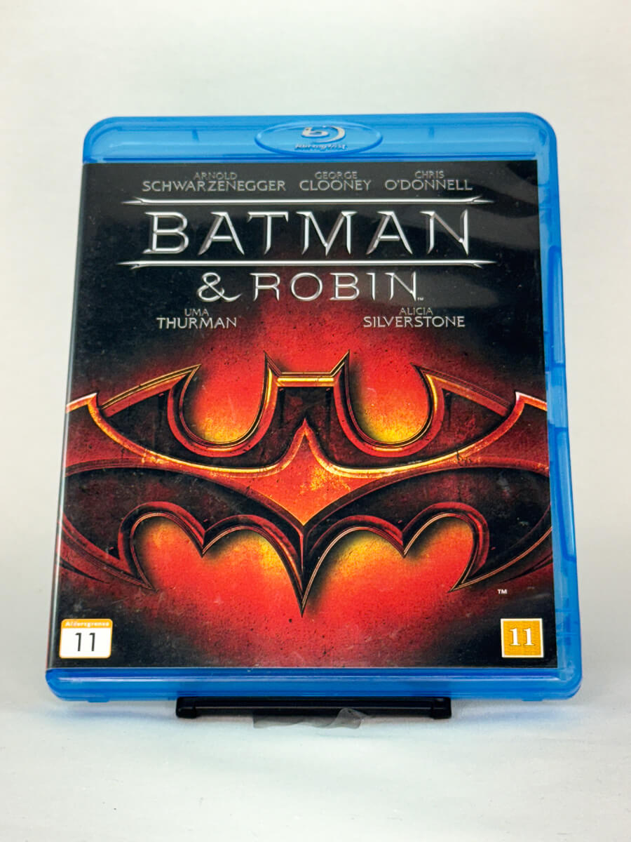 Forside av Blu-ray-coveret til Batman & Robin – superheltfilm fra 1997 med George Clooney og Arnold Schwarzenegger, brukt originalfilm hos Brukbar Film
