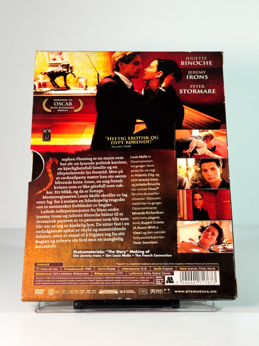 Bakside av cover til Damage, bruktfilm hos nettbutikken Brukbar Film