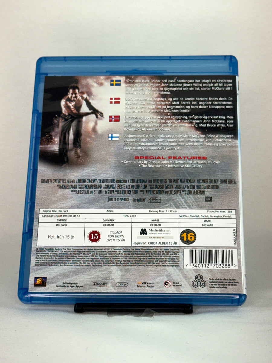 Bakside av Blu-ray-cover til Die Hard – brukt originalfilm regissert av John McTiernan, tilgjengelig hos Brukbar Film