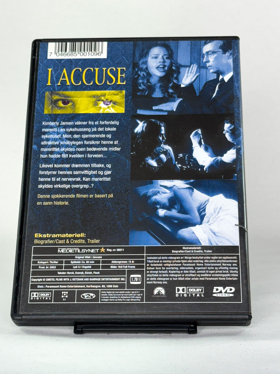 Bakside av DVD-cover til I Accuse – spenningsfilm om maktmisbruk og rettferdighet med John Hannah – original brukt DVD hos Brukbar Film.