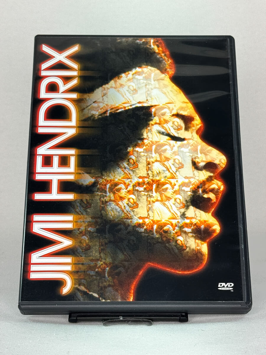 Forside av DVD-cover til Jimi Hendrix, dokumentaren som fanger gitarlegenden i konsertopptak og intervjuer – brukt musikkdokumentar på DVD hos Brukbar Film.