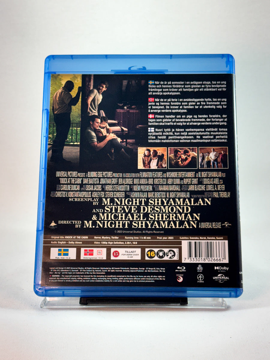 Bakside av cover til Knock at the Cabin, bruktfilm hos nettbutikken Brukbar Film