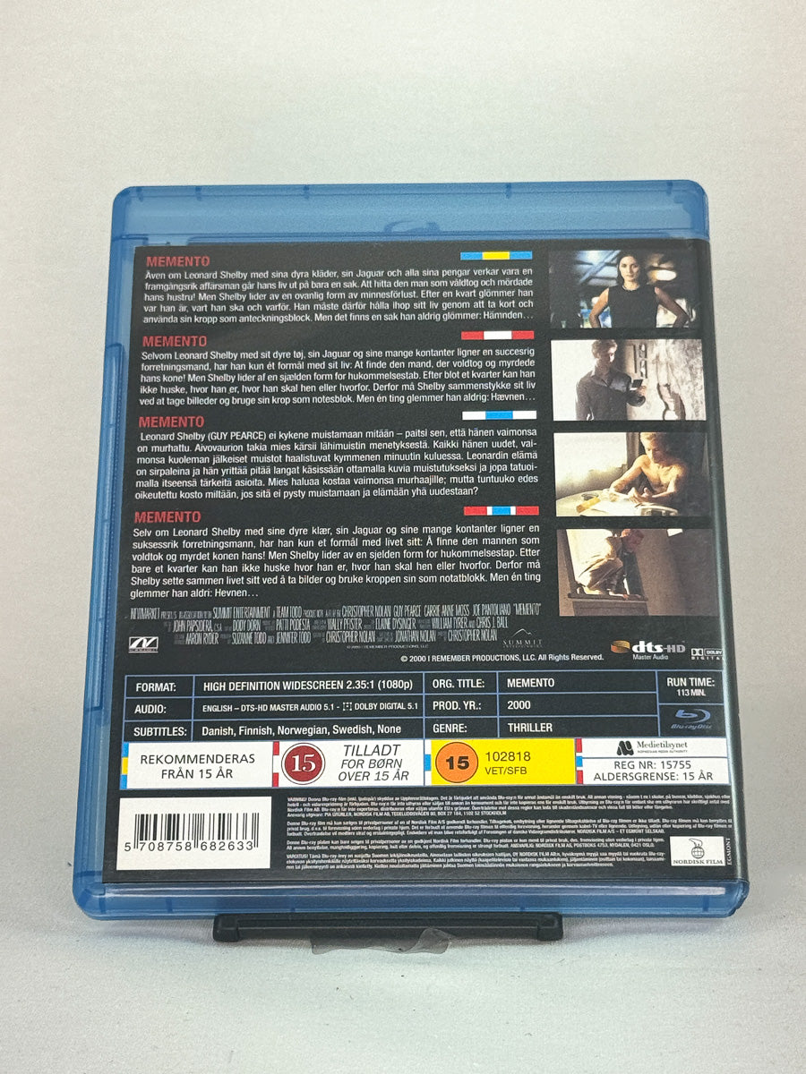 Bakside av Blu-ray-cover til Memento – brukt originalfilm i høy kvalitet, kjøp hos Brukbar Film