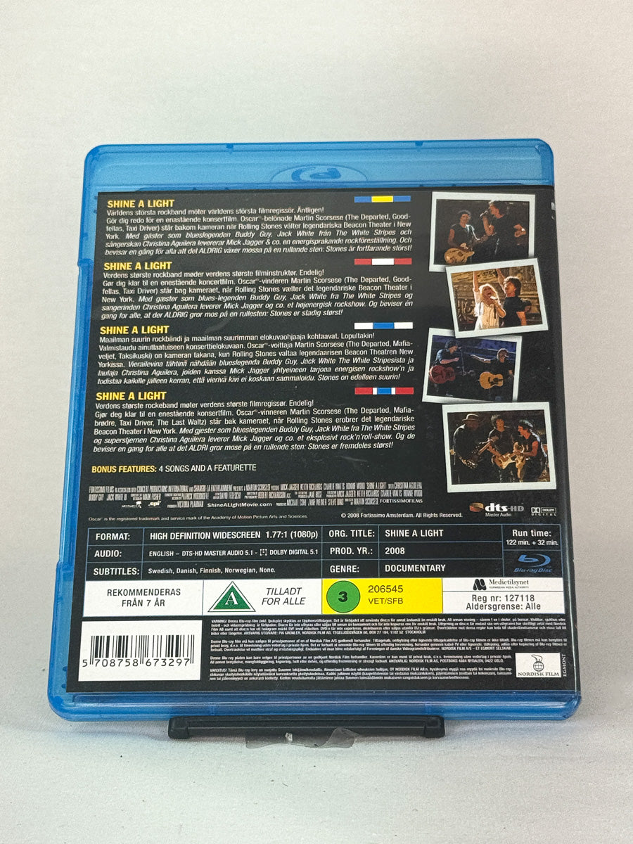Bakside av Blu-ray-cover for filmen Shine a Light – brukt musikkfilm på Blu-ray, tilgjengelig hos Brukbar Film