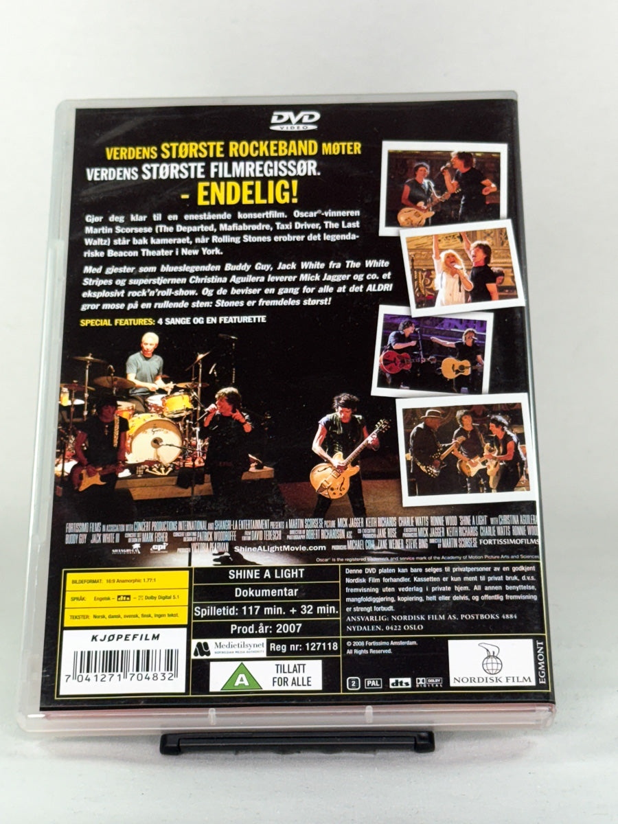 Bakside av DVD-cover til Shine a Light – dokumentarfilm av Martin Scorsese med The Rolling Stones, inkludert gjesteopptredener og konsertopptak, brukt DVD tilgjengelig hos Brukbar Film