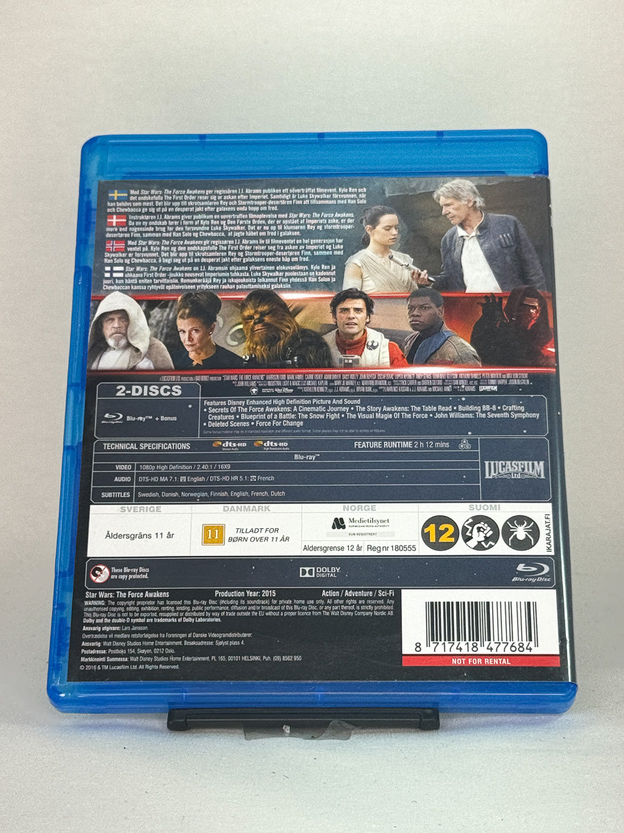 Bakside av Blu-ray-cover for Star Wars: The Force Awakens – informasjon om spesialfunksjoner og bonusinnhold, brukt Blu-ray hos Brukbar Film.