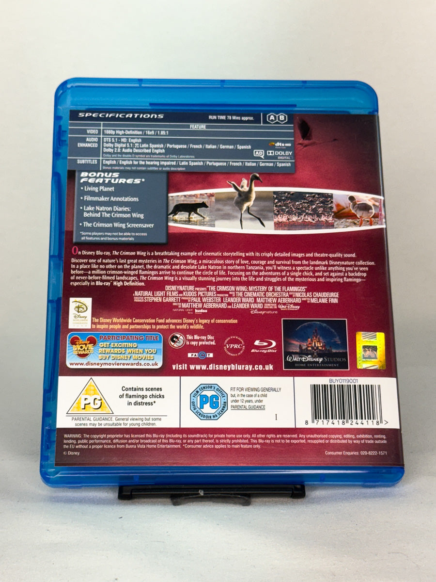Bakside av Blu-ray-cover til The Crimson Wing: Mystery of the Flamingos – visuelt imponerende dokumentarfilm med musikk og natur i fokus, brukt Blu-ray tilgjengelig hos Brukbar Film.