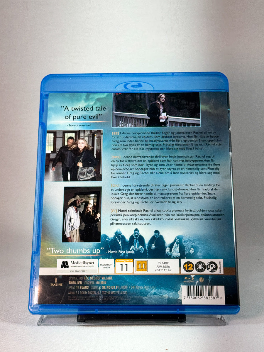 Bakside av cover til The Secret Village, brukt Blu-ray hos Brukbar Film