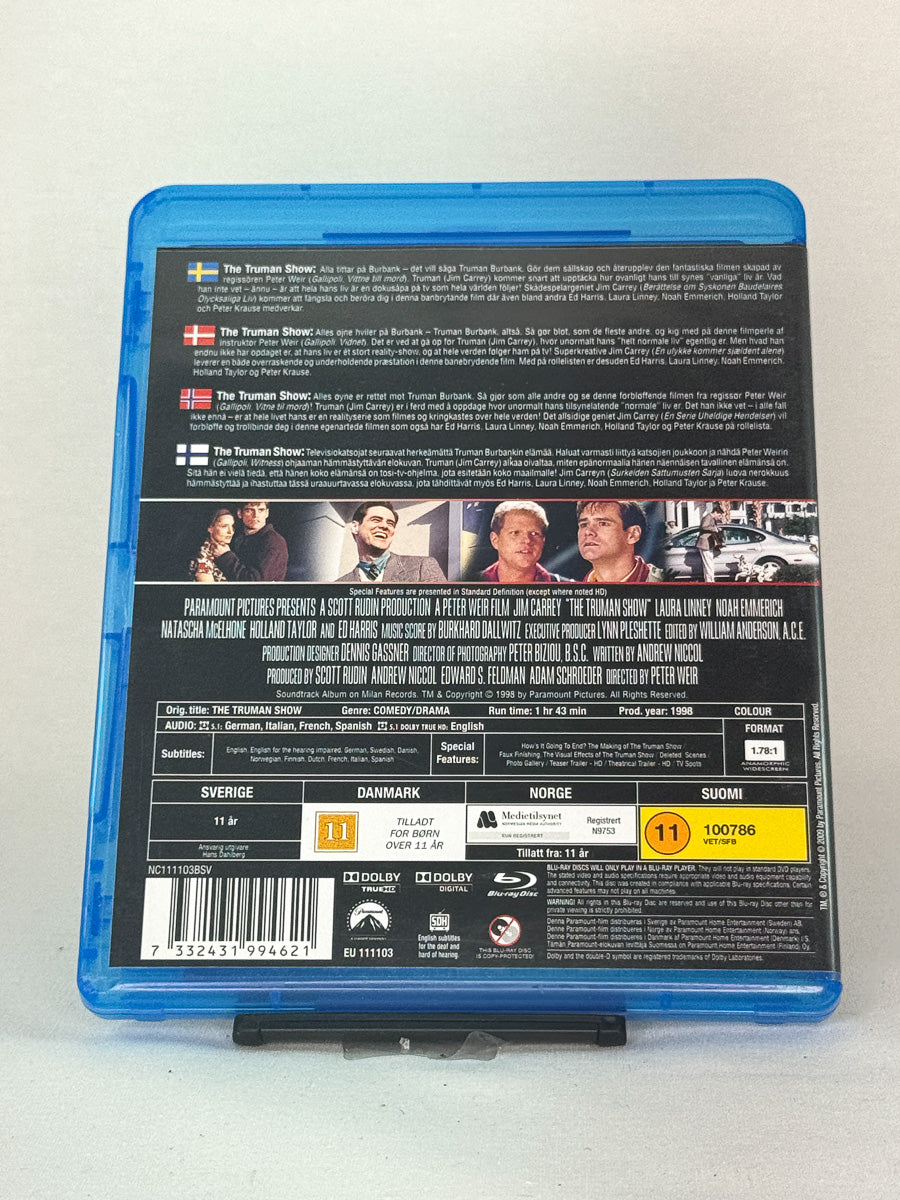 Bakside av Blu-ray-cover for The Truman Show – detaljer om filmen, rollebesetning og teknisk informasjon, brukt film hos Brukbar Film.