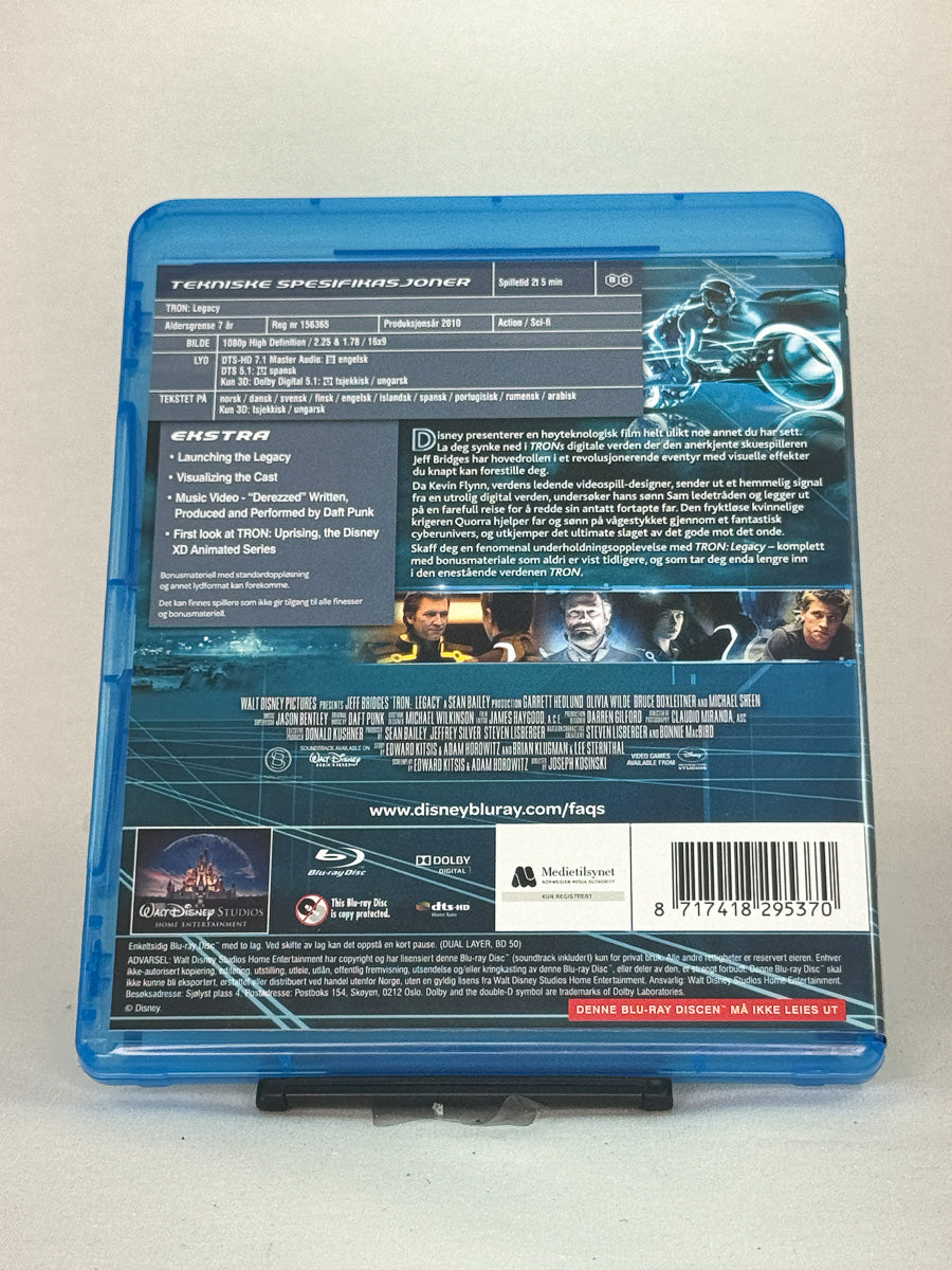 Bakside av Blu-ray-cover til Tron: Legacy – 3D-versjon inkludert, sci-fi-eventyr fra Disney, tilgjengelig hos Brukbar Film.