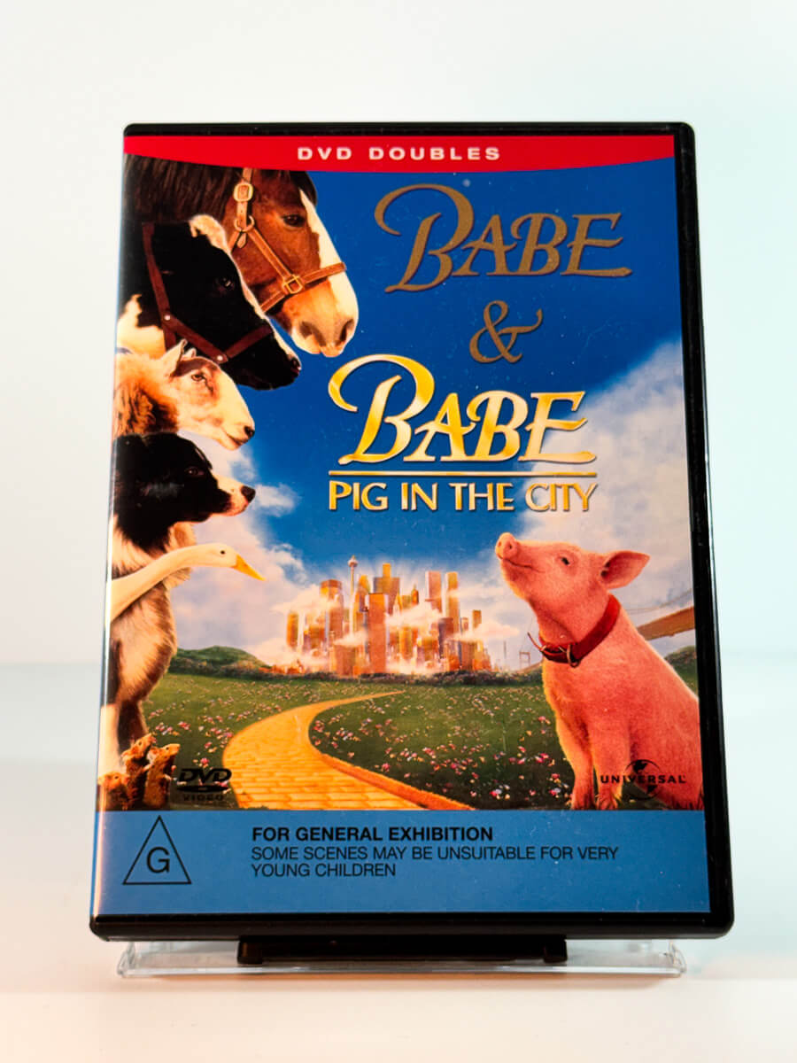 Forside av cover til babe and babe pig in the city, bruktfilm hos nettbutikken Brukbar Film