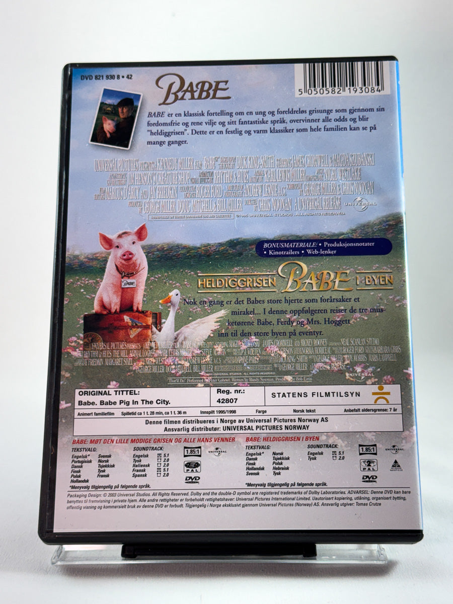 Bakside av DVD-cover til Babe & Heldiggrisen Babe i byen – 2 Disc med oversikt over innhold og teknisk info; brukt familiefilm på DVD hos Brukbar Film