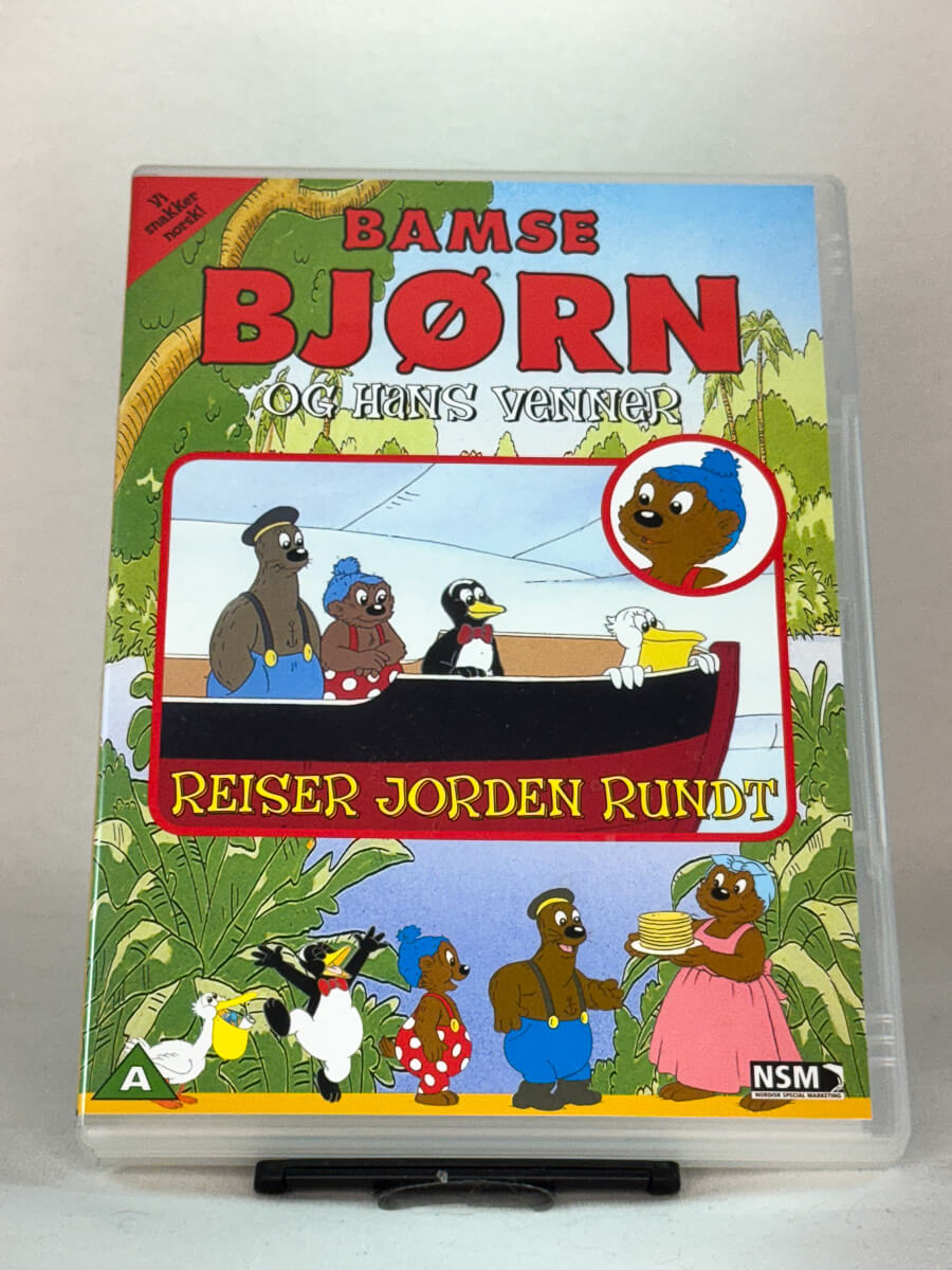 Forside av DVD-cover til Bamse Bjørn og hans venner – Reiser jorden rundt – norsk klassisk barnefilm med kjente figurer og sang, brukt familiefilm på DVD hos Brukbar Film.