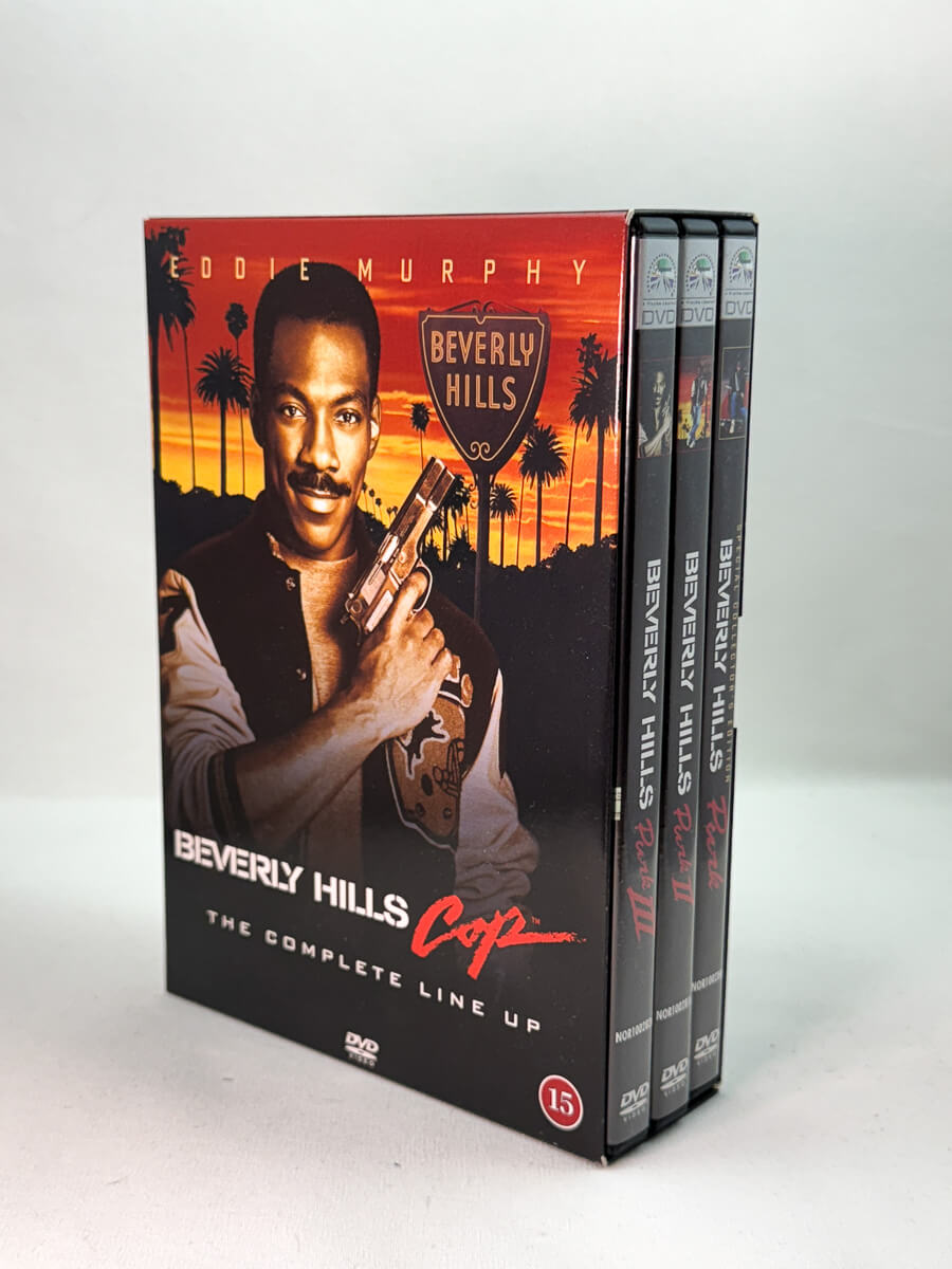 Forside av DVD-cover til Beverly Hills Cop – The Complete Line Up, bruktfilm hos nettbutikken Brukbar Film