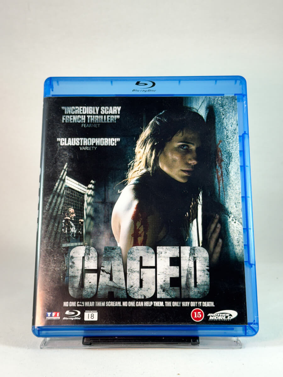 Forside av cover til Caged, brukt Blu-ray hos Brukbar Film