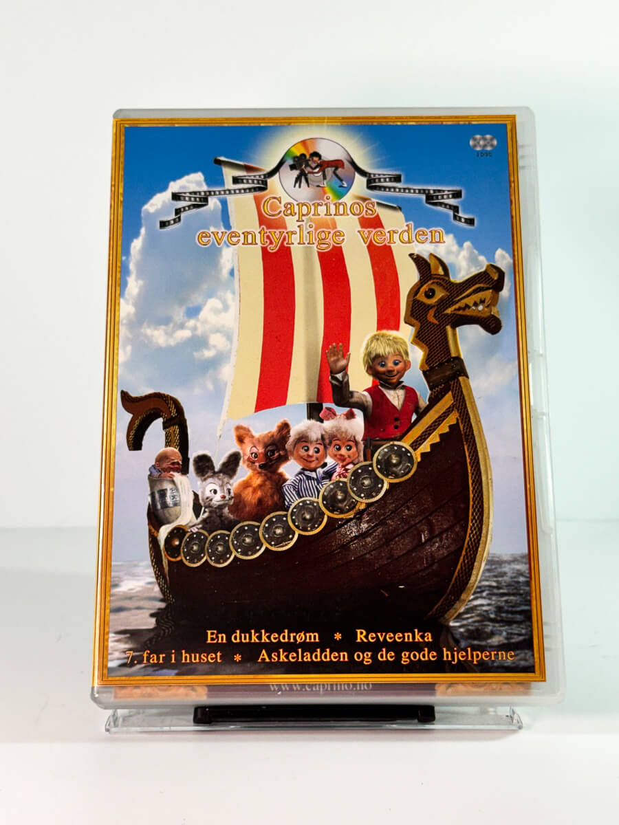 Forside av cover til caprinos eventyrlige verden 3 – en dukkedrøm reveenka 7 far i huset askeladden og de gode hjelperne, bruktfilm hos nettbutikken Brukbar Film