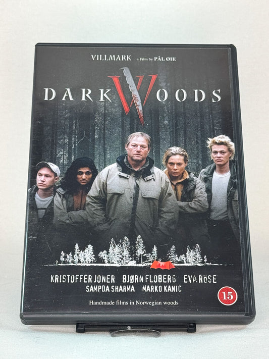 Forside av DVD-cover til Dark Woods (Villmark) (2003) – norsk grøsser regissert av Pål Øie med Kristoffer Joner og Bjørn Floberg – brukt skrekkfilm på DVD hos Brukbar Film.