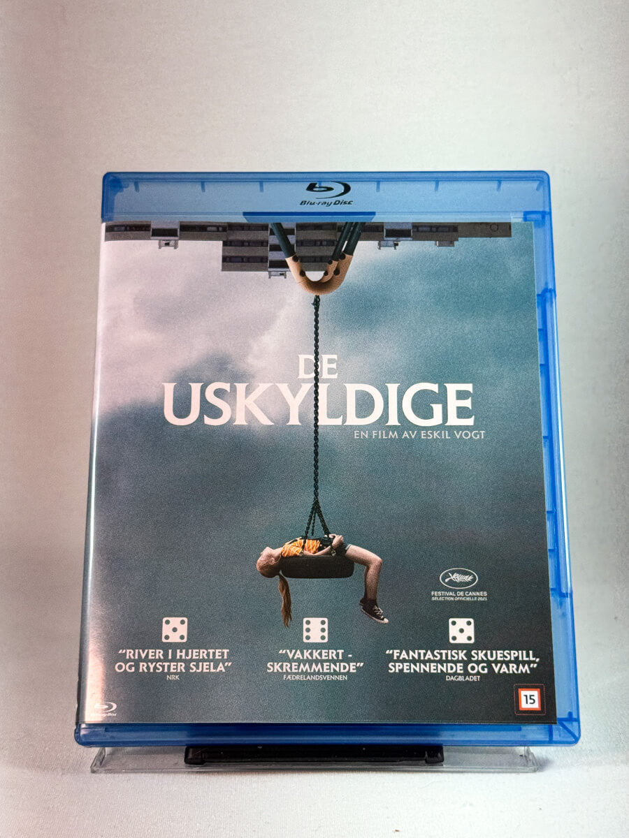 Forside av cover til De uskyldige, bruktfilm hos nettbutikken Brukbar Film 