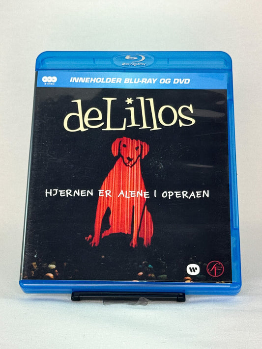 Forside av Blu-ray-cover til deLillos – Hjernen er alene i Operaen – brukt Blu-ray konsertutgivelse, tilgjengelig hos Brukbar Film
