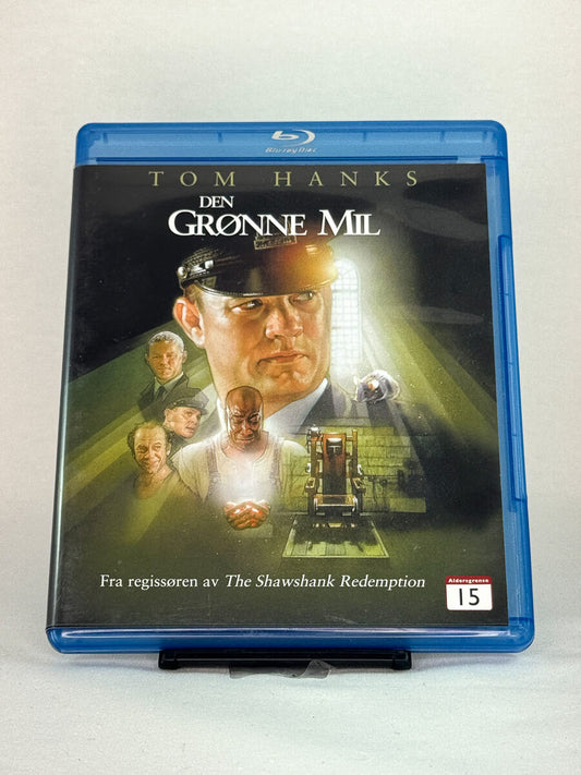 Forside av Blu-ray-cover til Den grønne mil (originaltittel: The Green Mile) – rørende fengselsdrama med Tom Hanks, basert på Stephen Kings roman, brukt Blu-ray hos Brukbar Film.