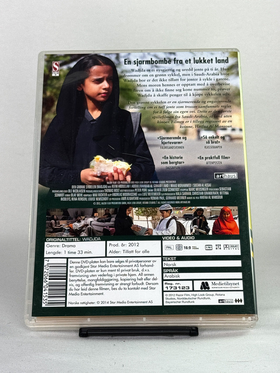 Bakside av Den grønne sykkelen – gripende og viktig film om frihet og drømmer, brukt DVD fra Brukbar Film.