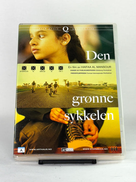 Forside av DVD-cover til Den grønne sykkelen – kritikerrost drama av Haifaa Al Mansour, prisvinnende film utgitt av Arthaus og Star Media, hos Brukbar Film.
