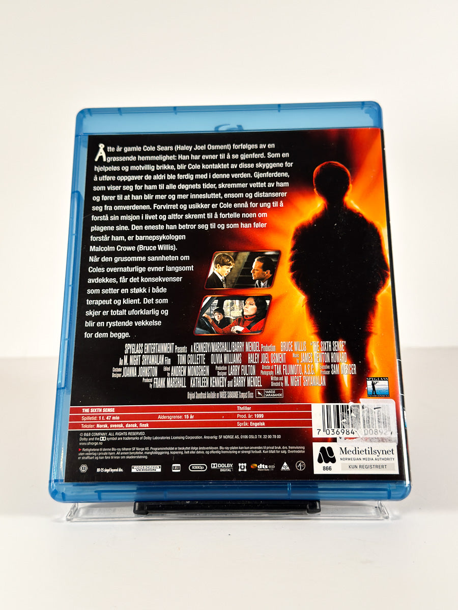 Bakside av cover til Den sjette sansen på Blu-ray