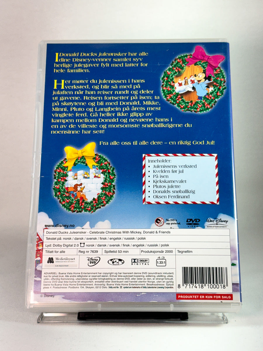 Bakside av DVD-cover til Donald Ducks juleønsker, animerte juleepisoder med klassiske Disney-figurer, brukt DVD hos Brukbar Film