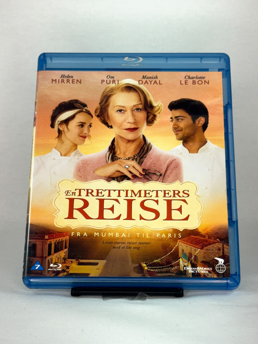 Forside av Blu-ray-cover til En trettimeters reise (The Hundred-Foot Journey) – brukt dramakomedie på Blu-ray, kjøp hos Brukbar Film