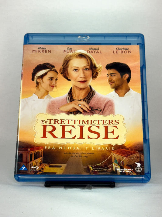 Forside av Blu-ray-cover til En trettimeters reise (The Hundred-Foot Journey) – brukt dramakomedie på Blu-ray, kjøp hos Brukbar Film