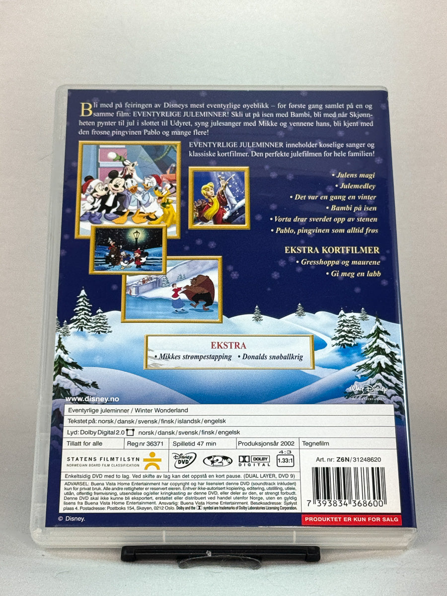 Bakside av DVD-cover til Eventyrlige juleminner – varm julefilm med kjente Disney-figurer i klassiske julefortellinger, brukt originalfilm hos Brukbar Film.