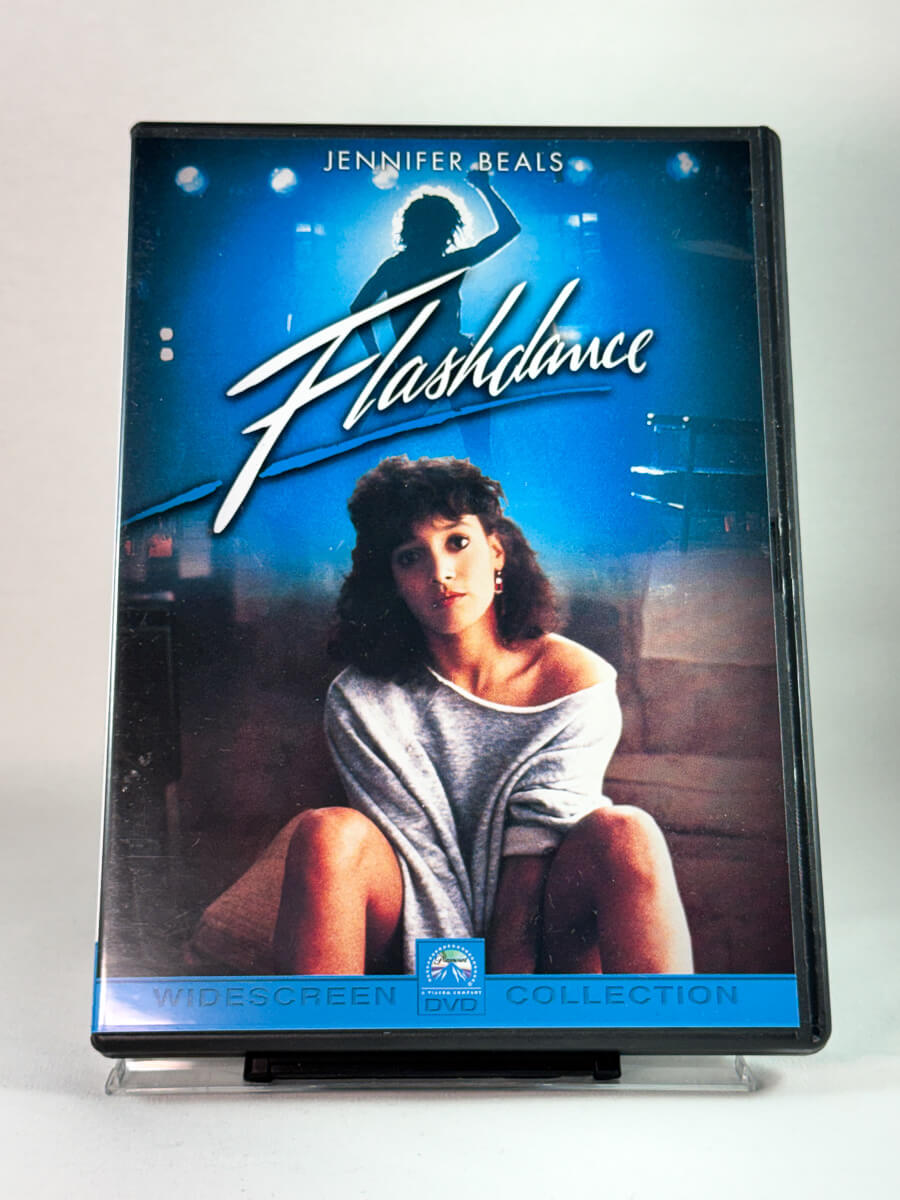 Flashdance – forside av ikonisk dansefilm på DVD, brukt utgave hos Brukbar Film