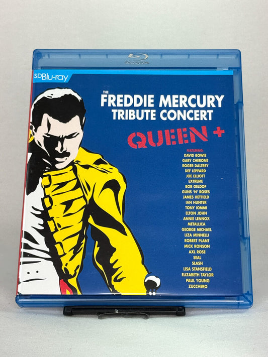Forside av Blu-ray-cover til The Freddie Mercury Tribute Concert – Queen og gjesteartister som David Bowie og Elton John, brukt Blu-ray hos Brukbar Film.