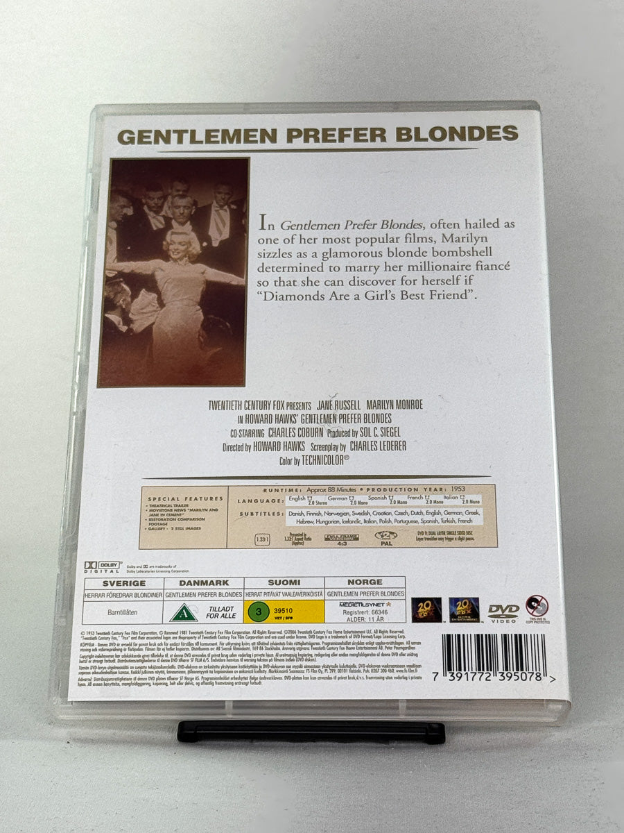 Bakside av DVD-cover til Gentlemen Prefer Blondes – brukt musikal/komedie; detaljer om innhold og språk.