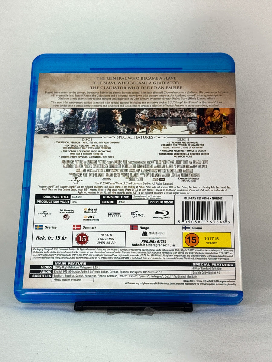 Bakside av Blu-ray-cover til Gladiator – prisvinnende storfilm med Oscar-vinnende prestasjoner, brukt Blu-ray 2-disc-utgave hos Brukbar Film.