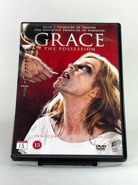 Forside av DVD-cover til Grace: The Possession – skrekkfilm fra produsentene av Insidious og Sinister – brukt DVD tilgjengelig hos Brukbar Film.
