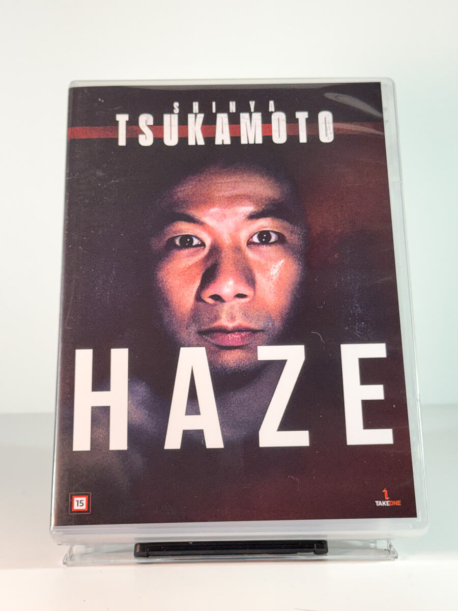 Forside av cover til Haze, bruktfilm på DVD hos Brukbar Film