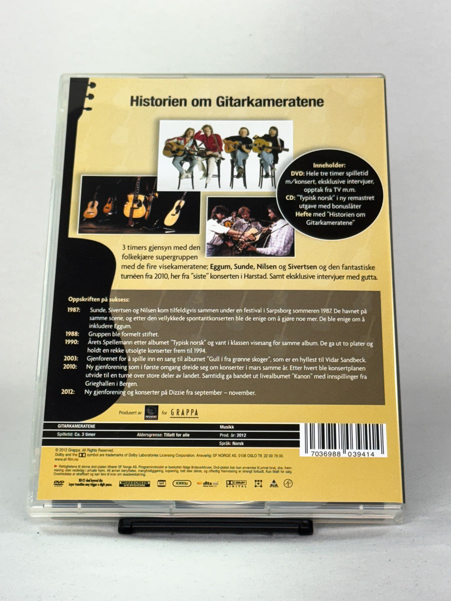 Bakside av DVD-cover til Historien om Gitarkameratene – dokumentarfilm med konserter, intervjuer og bonusinnhold, utgitt på Grappa, hos Brukbar Film