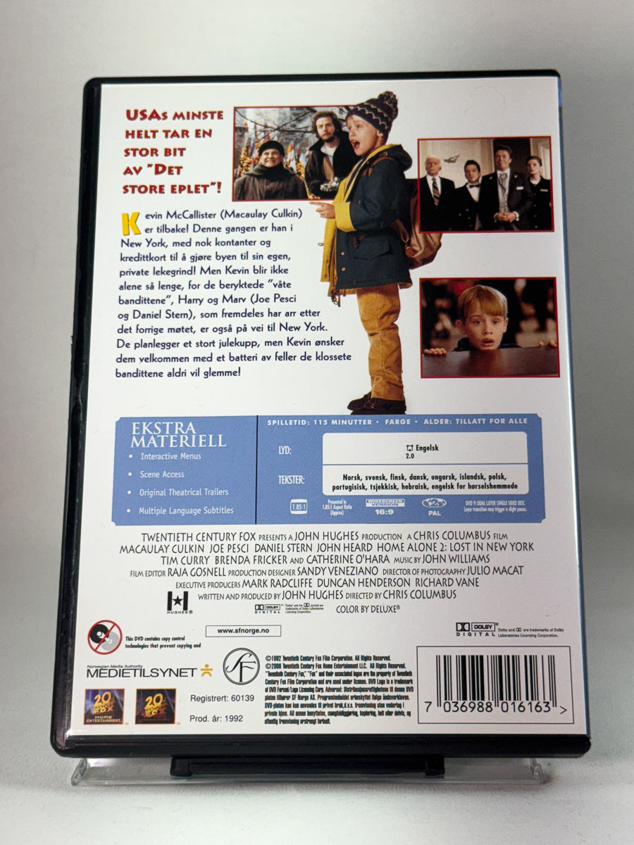 Bakside av DVD-cover for Hjemme Alene 2, second hand DVD med info om språk og ekstramateriale hos Brukbar Film