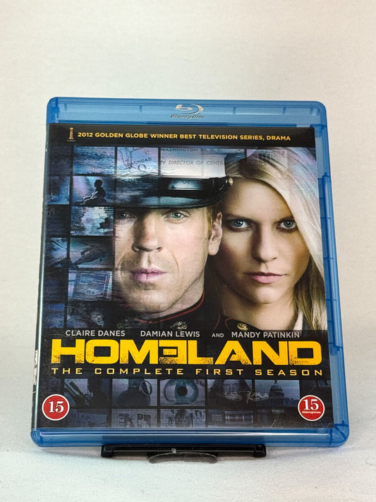 Forside av Homeland – The Complete First Season på Blu-ray – brukt filmcover av prisvinnende dramaserie, tilgjengelig hos Brukbar Film.