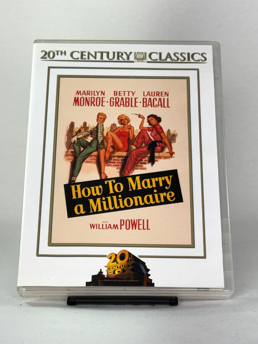 How to Marry a Millionaire – forside av brukt DVD-cover med Marilyn Monroe, Lauren Bacall og Betty Grable; klassisk komedie hos Brukbar Film.