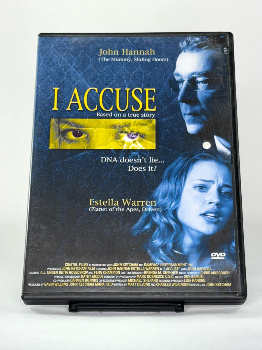 Forside av DVD-cover til I Accuse – thriller basert på sann historie med John Hannah og Estella Warren – brukt DVD tilgjengelig hos Brukbar Film.
