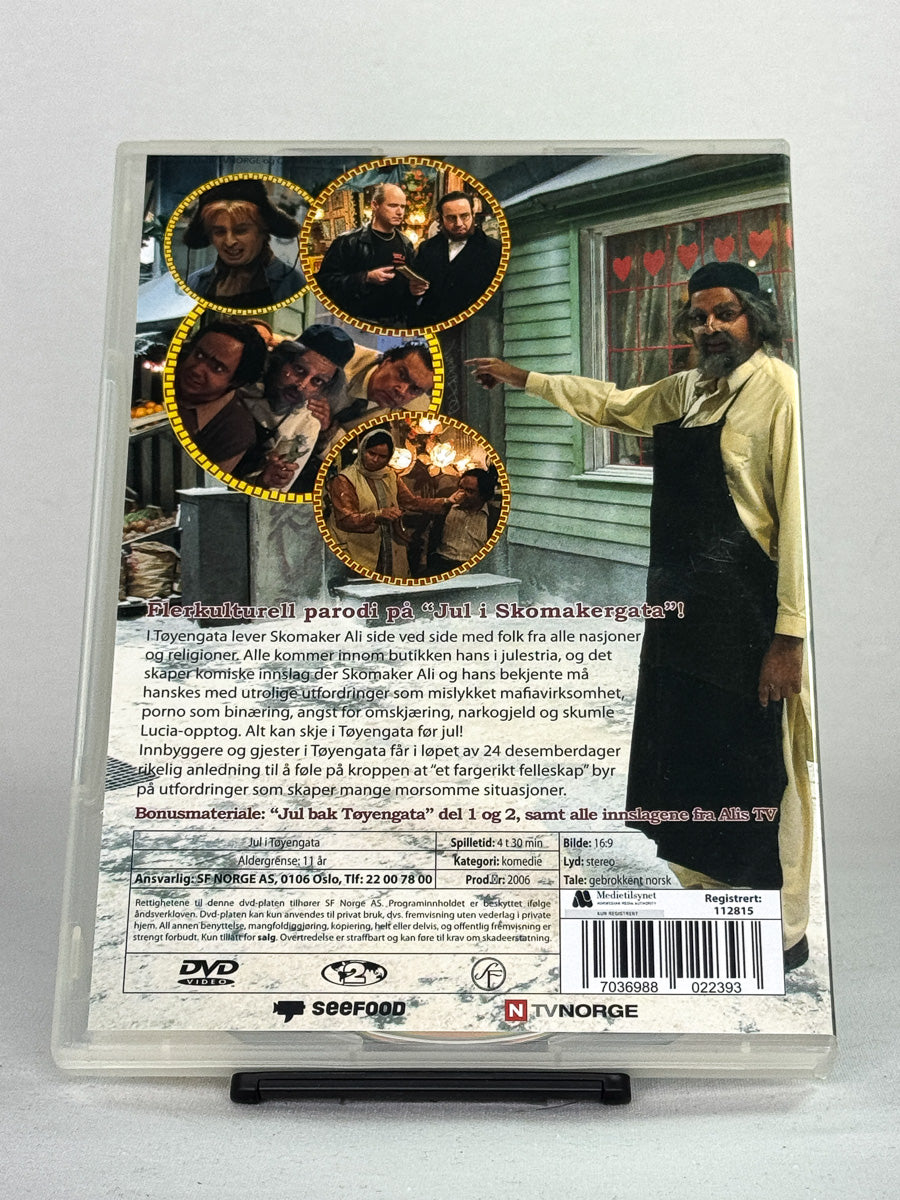 DVD-bakside til filmen Jul i Tøyengata
Baksiden viser info, spesifikasjoner og eventuell ekstratekst – produktbilde fra nettbutikken Brukbar Film