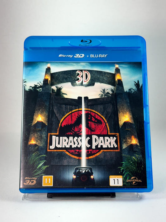 Forside av DVD-cover til Jurassic Park (Blu-ray 3D), bruktfilm hos nettbutikken Brukbar Film