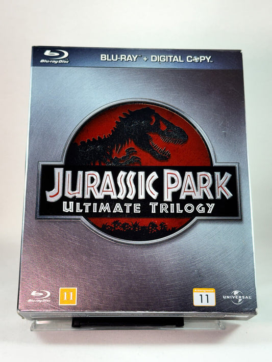 Jurassic Park – Ultimate Trilogy – forside av Blu-ray-cover, samleboks med alle tre filmer, hos Brukbar Film