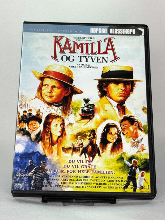 Forside av DVD-cover til Kamilla og tyven – norsk klassiker regissert av Grete Salomonsen med Veronika Flåt og Dennis Storhøi, en rørende familiefortelling – brukt DVD hos Brukbar Film.