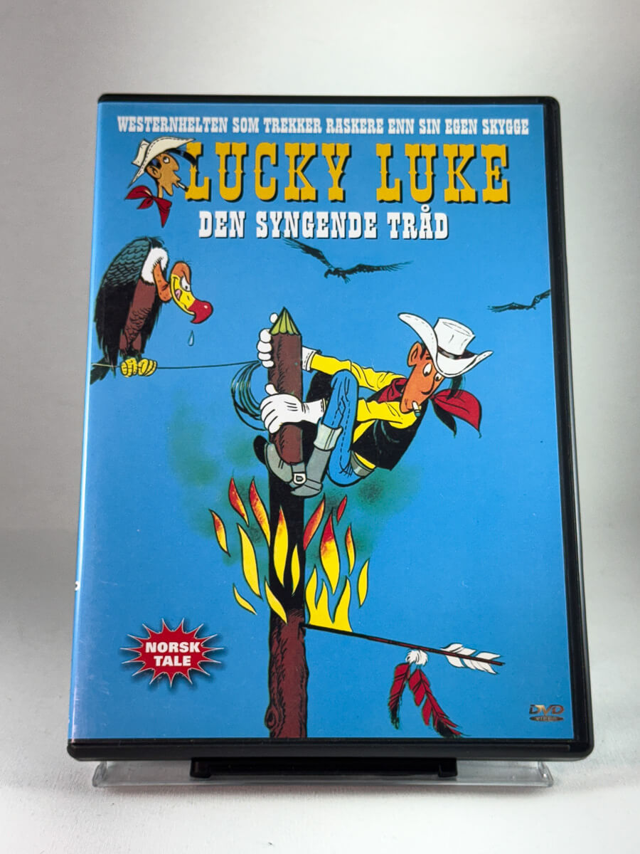 Forside av DVD-cover til Lucky Luke – Den syngende tråd, brukt western-tegnefilm på DVD med norsk tale hos Brukbar Film