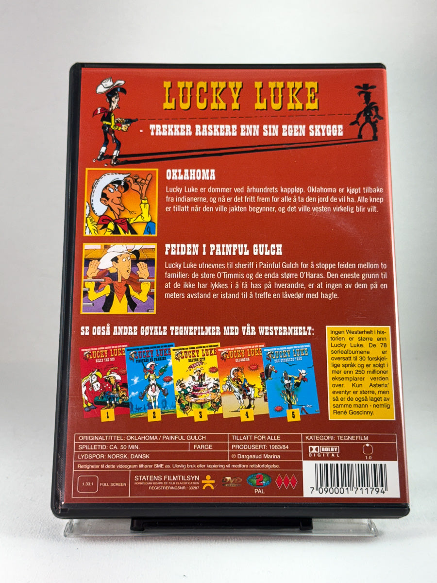 Bakside av DVD-cover til Lucky Luke – Oklahoma, brukt DVD-tegnefilm med oversikt over episodene og informasjon om utgivelsen hos Brukbar Film