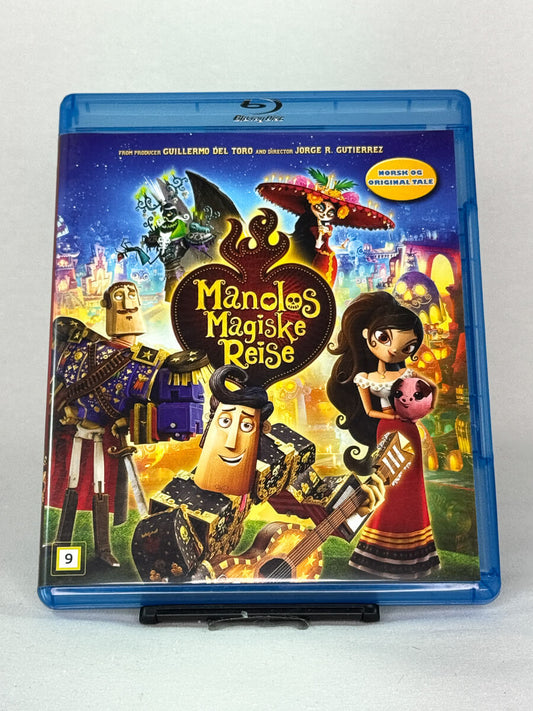 Forside av Blu-ray-cover til Manolos magiske reise – visuelt mesterverk produsert av Guillermo del Toro med norsk og original tale, brukt film hos Brukbar Film.