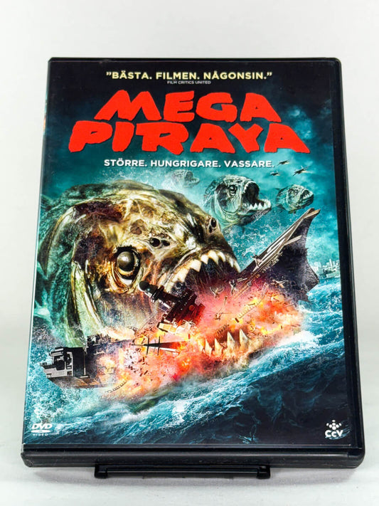 Brukt DVD-film Mega Piranha – forside av filmcover med eksplosiv fiskaction, original bruktfilm tilgjengelig hos Brukbar Film